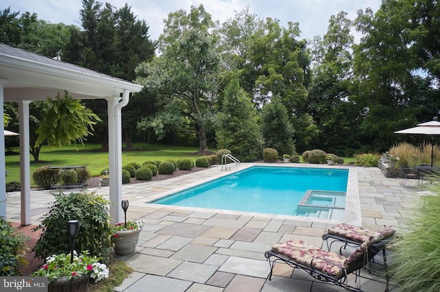 view of swimming pool with a patio, a gazebo, a pool with connected hot tub, and a lawn