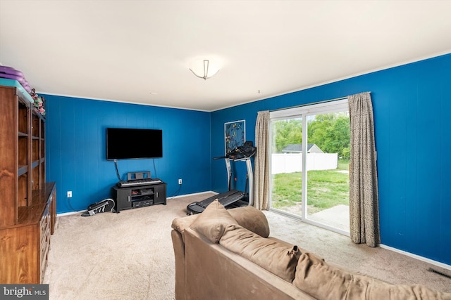 living area with carpet floors, baseboards, and visible vents