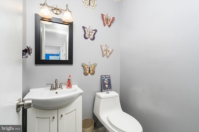 bathroom with toilet and vanity