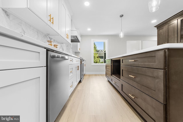 walk in closet with light wood-style floors
