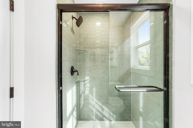 bathroom featuring a stall shower