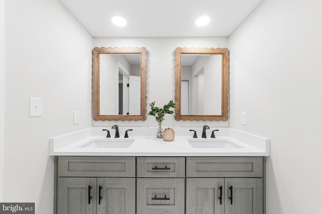 full bathroom featuring a sink and double vanity