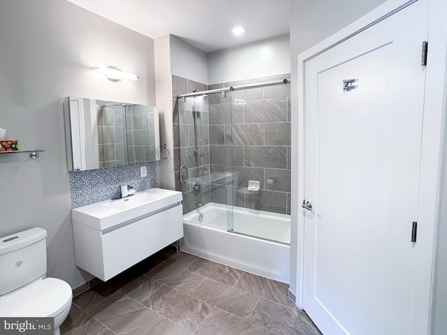 989 S Buchanan St Unit 221, Arlington, VA 22204 - bathroom featuring toilet, shower / bath combination with glass door, vanity, and tasteful backsplash