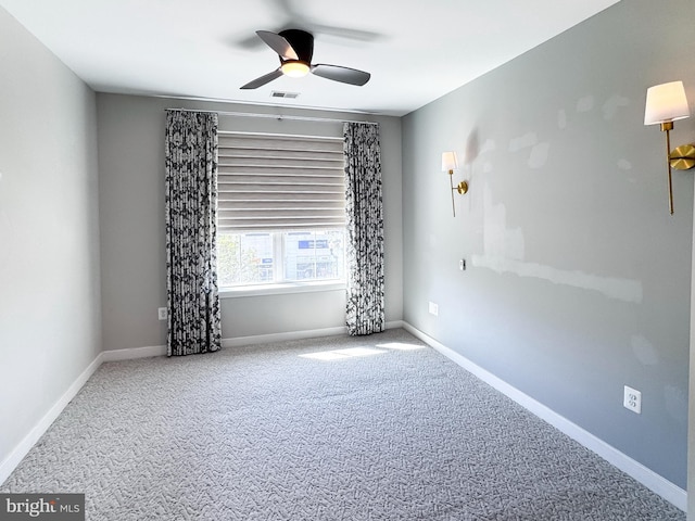 989 S Buchanan St Unit 221, Arlington, VA 22204 - empty room featuring ceiling fan, baseboards, carpet, and visible vents