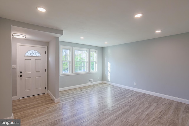 entrance foyer featuring recessed lighting, baseboards, visible vents, and light wood finished floors