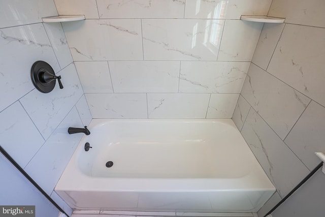 bathroom with a bathtub and a shower