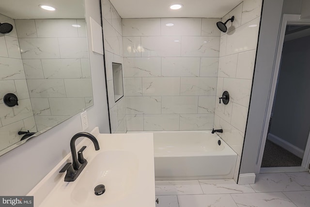 full bathroom featuring recessed lighting, a sink, marble finish floor, and bathtub / shower combination