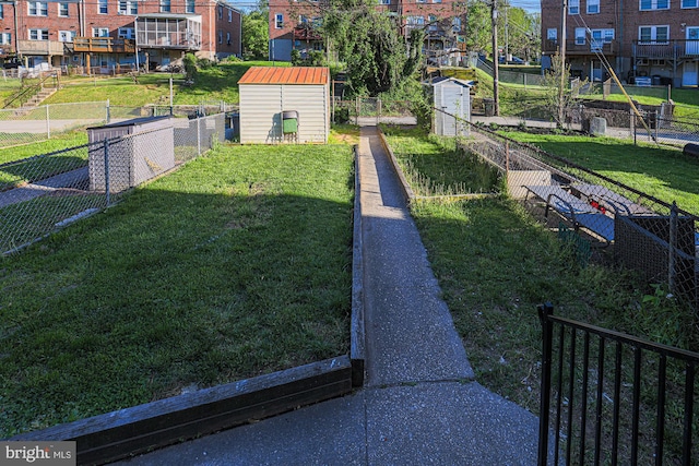 exterior space featuring an outdoor structure, fence, and a storage shed