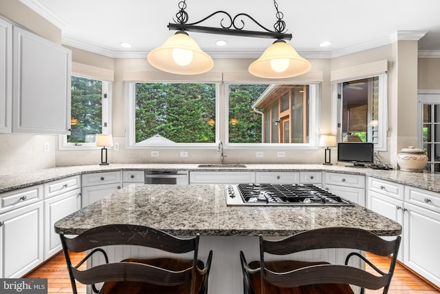 9 Selsed Garth, Lutherville Timonium, MD 21093 - kitchen featuring a sink, a breakfast bar area, white cabinets, and stainless steel appliances