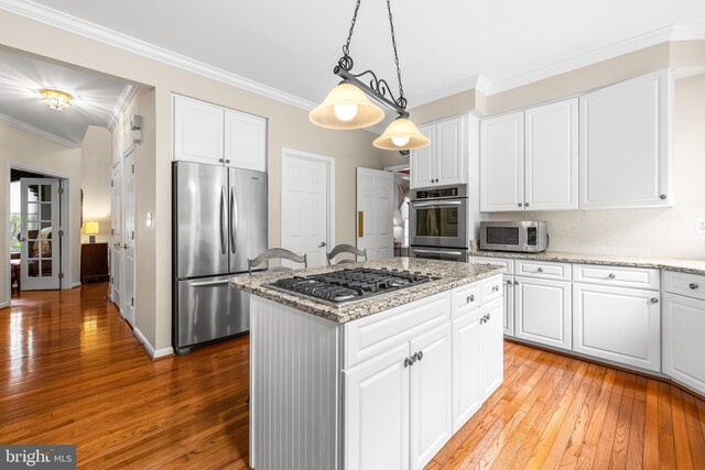 9 Selsed Garth, Lutherville Timonium, MD 21093 - kitchen with crown molding, stainless steel appliances, a center island, and light wood-type flooring