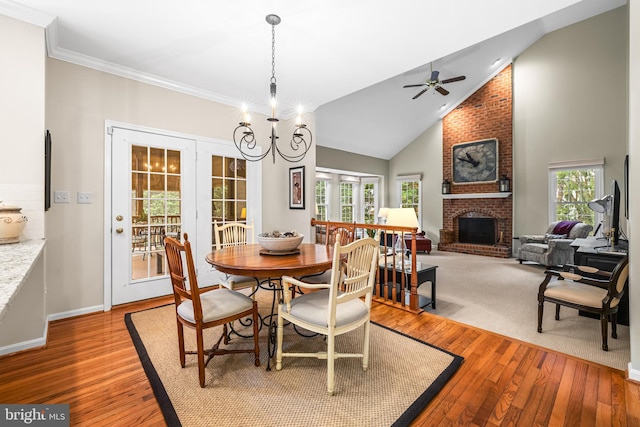 9 Selsed Garth, Lutherville Timonium, MD 21093 - dining space with wood-type flooring, a ceiling fan, lofted ceiling, and a fireplace