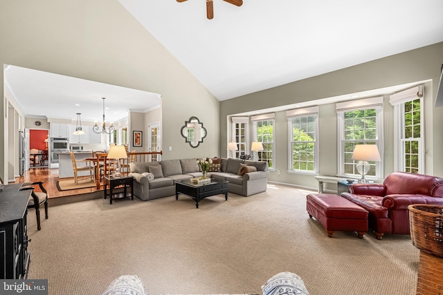 9 Selsed Garth, Lutherville Timonium, MD 21093 - carpeted living room featuring crown molding, high vaulted ceiling, and ceiling fan with notable chandelier