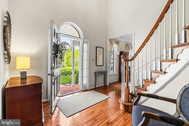 9 Selsed Garth, Lutherville Timonium, MD 21093 - entrance foyer with wood-type flooring, baseboards, a high ceiling, and stairway