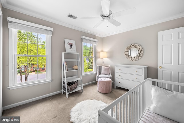 9 Selsed Garth, Lutherville Timonium, MD 21093 - carpeted bedroom featuring visible vents, ornamental molding, baseboards, a crib, and a ceiling fan