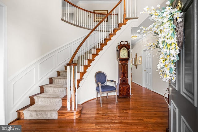9 Selsed Garth, Lutherville Timonium, MD 21093 - foyer with a high ceiling, ornamental molding, stairs, and wood finished floors