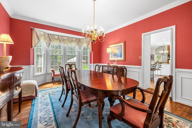 9 Selsed Garth, Lutherville Timonium, MD 21093 - dining area featuring crown molding, wallpapered walls, an inviting chandelier, and a wainscoted wall