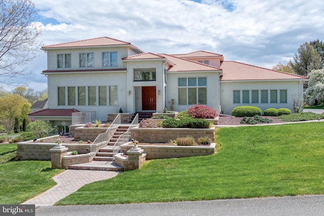 23 Deerfield Rd, Lancaster, PA 17603 - mediterranean / spanish home featuring stucco siding, a tiled roof, and a front yard