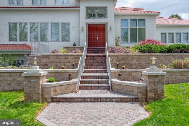 23 Deerfield Rd, Lancaster, PA 17603 - doorway to property featuring a tile roof and stucco siding