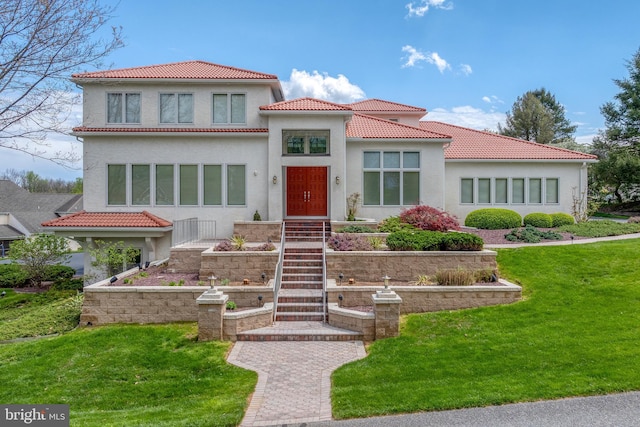 23 Deerfield Rd, Lancaster, PA 17603 - view of front of property with stucco siding, a front yard, and a tiled roof