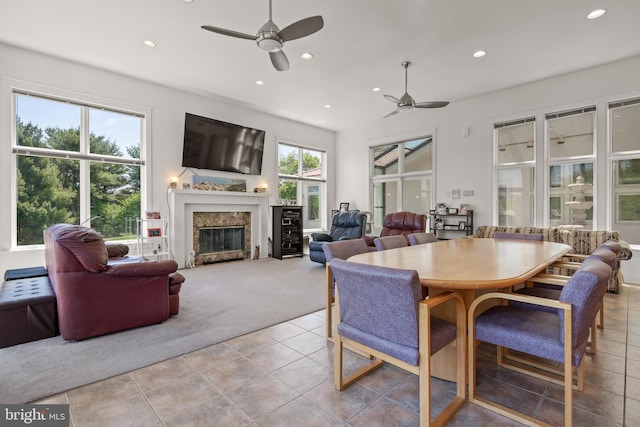 23 Deerfield Rd, Lancaster, PA 17603 - dining area featuring recessed lighting, light tile patterned floors, light carpet, a fireplace, and a ceiling fan