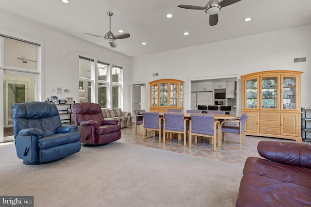 23 Deerfield Rd, Lancaster, PA 17603 - carpeted living area with recessed lighting, a ceiling fan, visible vents, a towering ceiling, and tile patterned flooring