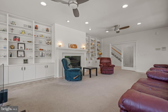 23 Deerfield Rd, Lancaster, PA 17603 - living room with a glass covered fireplace, a ceiling fan, recessed lighting, and stairs