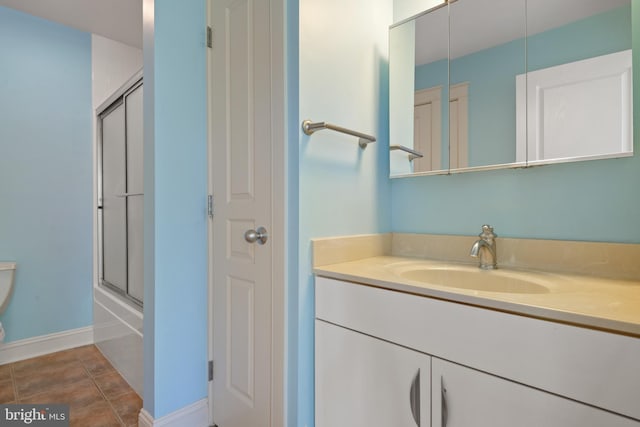 23 Deerfield Rd, Lancaster, PA 17603 - bathroom featuring toilet, bath / shower combo with glass door, vanity, and baseboards