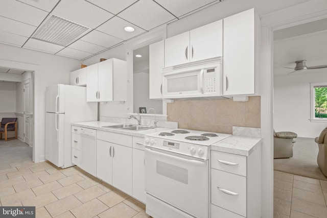 23 Deerfield Rd, Lancaster, PA 17603 - kitchen with white appliances, light countertops, white cabinets, and a sink
