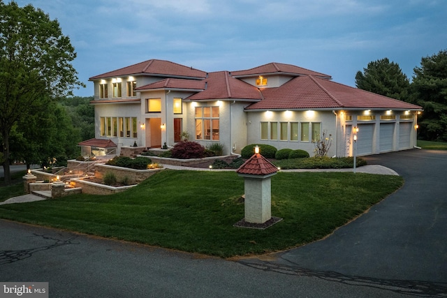 23 Deerfield Rd, Lancaster, PA 17603 - mediterranean / spanish-style home featuring a front lawn, driveway, a garage, and a tiled roof