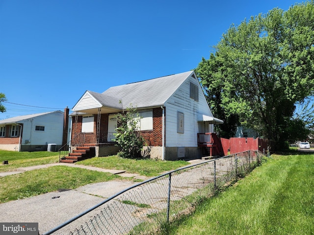 130 5th Ave, Baltimore, MD 21227 - bungalow with brick siding, covered porch, and central AC