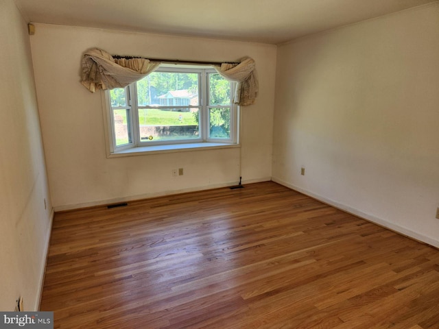 15498 Fleming St, King George, VA 22485 - unfurnished room featuring visible vents, wood finished floors, and baseboards