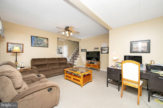 1104 High St, Haddon Heights, NJ 08035 - living room with light colored carpet, stairs, and a ceiling fan