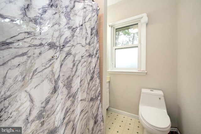 1104 High St, Haddon Heights, NJ 08035 - bathroom with tile patterned floors, toilet, a shower with curtain, and baseboards