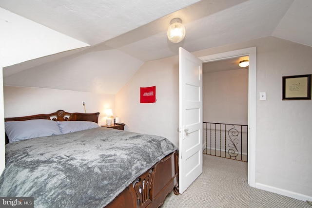 1104 High St, Haddon Heights, NJ 08035 - bedroom with vaulted ceiling, light carpet, and baseboards