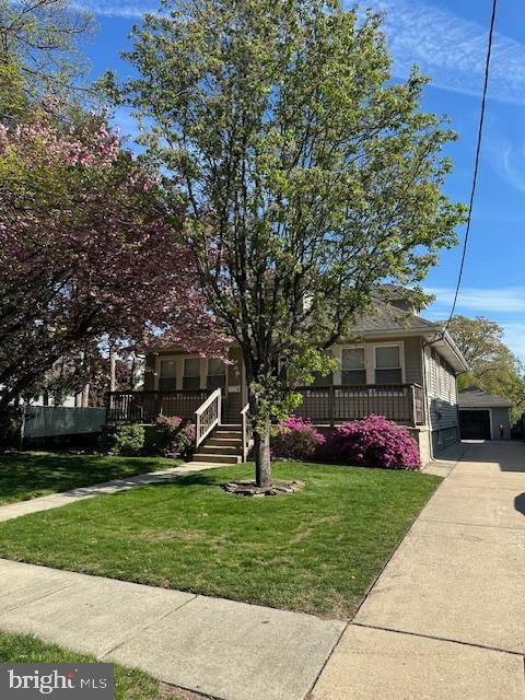 1104 High St, Haddon Heights, NJ 08035 - view of property hidden behind natural elements featuring a front yard and covered porch