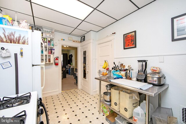 1104 High St, Haddon Heights, NJ 08035 - kitchen with white appliances, light flooring, and a paneled ceiling
