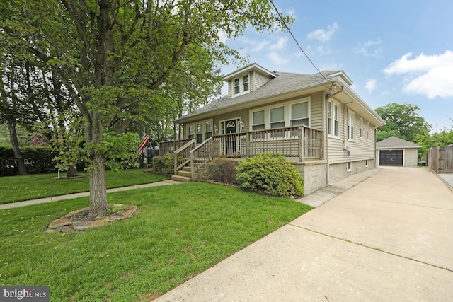 1104 High St, Haddon Heights, NJ 08035 - bungalow-style house with a detached garage, an outbuilding, a front yard, a porch, and concrete driveway