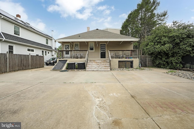 1104 High St, Haddon Heights, NJ 08035 - rear view of house with covered porch, fence, and central AC
