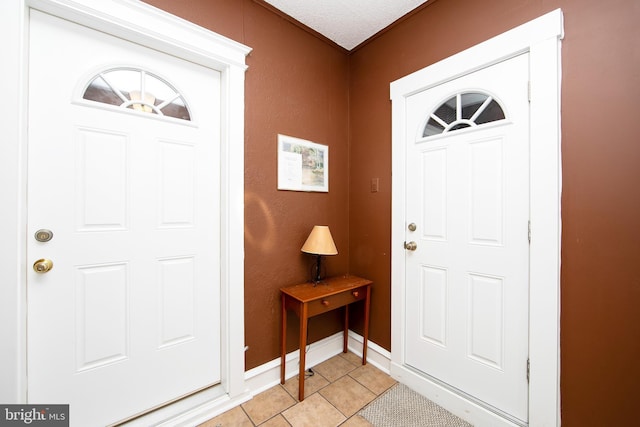 1104 High St, Haddon Heights, NJ 08035 - entrance foyer with light tile patterned floors, baseboards, and a textured wall