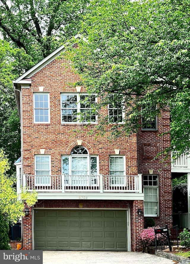 6732 Baron Rd, Mclean, VA 22101 - view of front of property with a garage, brick siding, and driveway
