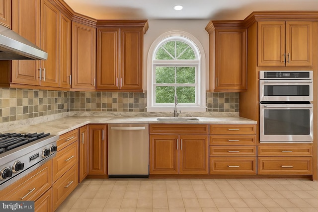 6732 Baron Rd, Mclean, VA 22101 - kitchen with stainless steel appliances, a sink, range hood, brown cabinetry, and recessed lighting