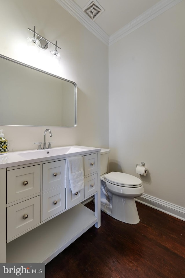 6732 Baron Rd, Mclean, VA 22101 - bathroom featuring crown molding, toilet, wood finished floors, vanity, and baseboards