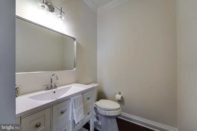 6732 Baron Rd, Mclean, VA 22101 - half bath featuring crown molding, vanity, baseboards, and toilet