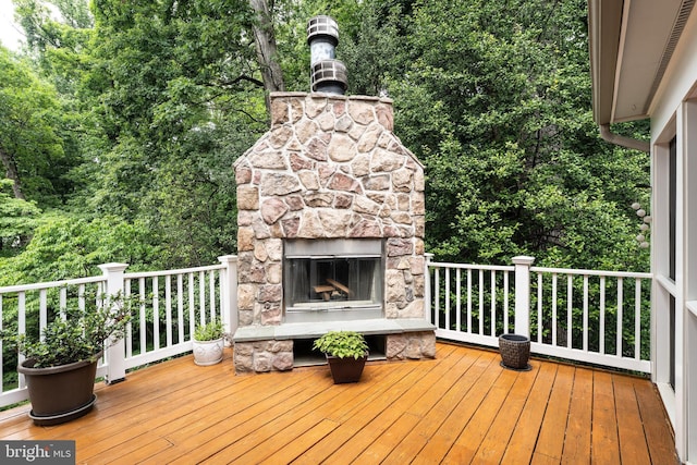 6732 Baron Rd, Mclean, VA 22101 - wooden terrace with an outdoor stone fireplace