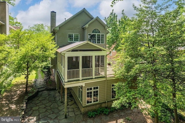 6732 Baron Rd, Mclean, VA 22101 - rear view of house featuring a sunroom and a chimney