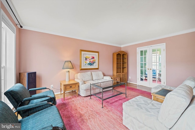 living area featuring ornamental molding, wood finished floors, french doors, and baseboards