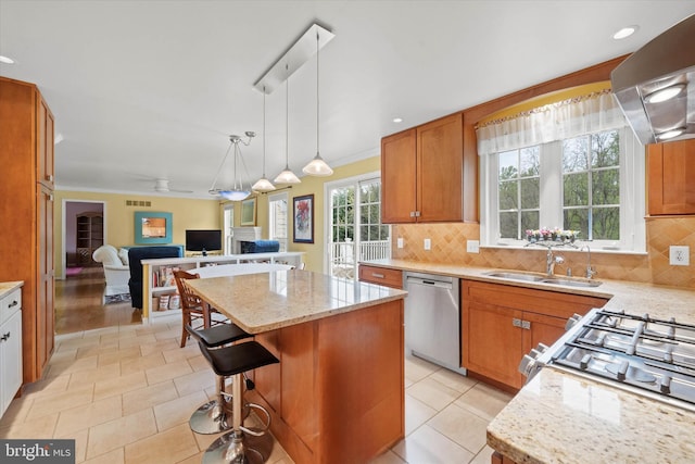 kitchen featuring exhaust hood, light stone counters, dishwasher, a sink, and a center island