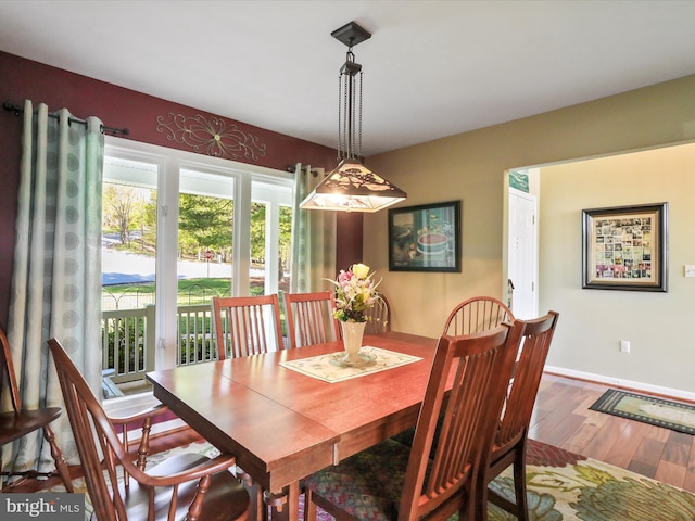 11 Spearpoint Ln, Hedgesville, WV 25427 - dining room with wood-type flooring and baseboards
