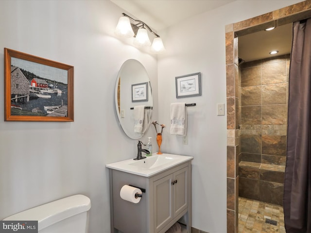 11 Spearpoint Ln, Hedgesville, WV 25427 - bathroom with vanity, a tile shower, and toilet