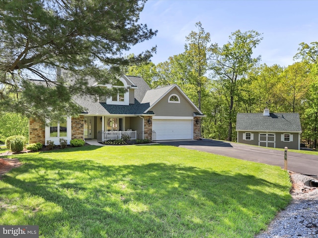 11 Spearpoint Ln, Hedgesville, WV 25427 - view of front of home with a porch, driveway, a front lawn, a shingled roof, and stone siding